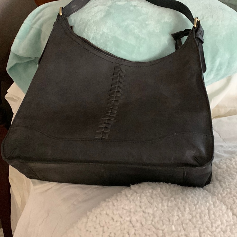 Purse carried once. Brand is BORN, dark brown smooth leather.